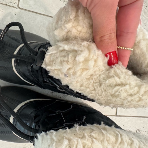 Sorel Kids’ Yoot Pac Waterproof Snow Boot Black and Faux-Shearling - Picture 6 of 9